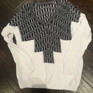 White and black sweater